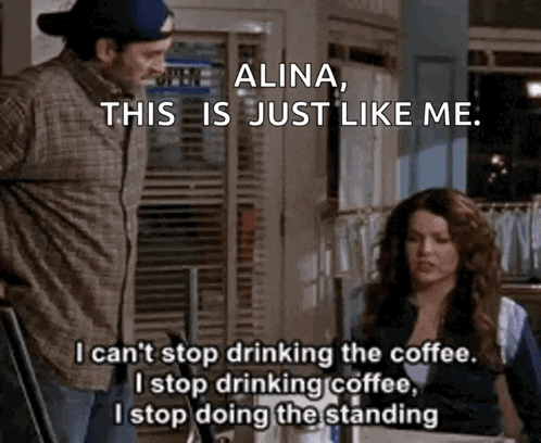a man and a woman are standing next to each other in a room and the woman is talking about drinking coffee