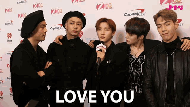 a group of young men standing next to each other with the words love you on the bottom right