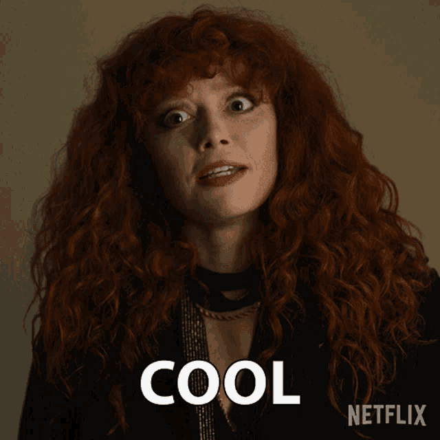 a woman with red hair has the word cool written in front of her