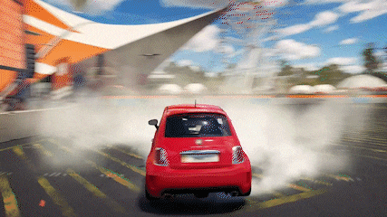 a red car is drifting in a parking lot with smoke coming out of the back