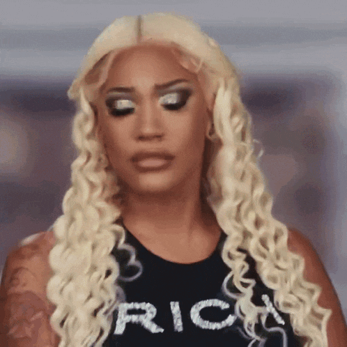 a woman with blonde hair is wearing a black shirt that says rick on it .