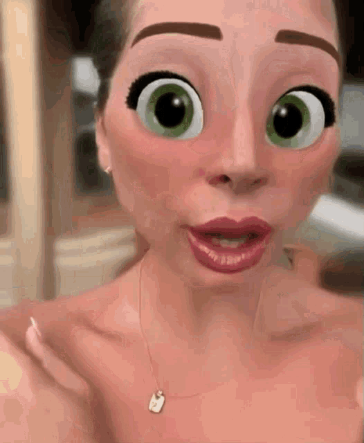 a woman with big green eyes and a necklace with a small pendant