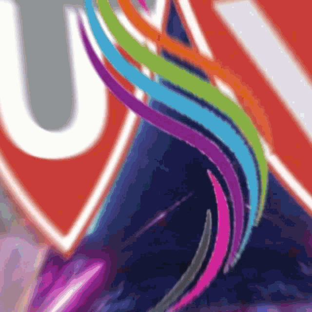 a colorful swirl with a white letter u in the middle