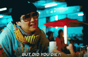 a man wearing sunglasses and a scarf is saying but did you die