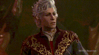 a man with white hair is wearing a red and gold costume .