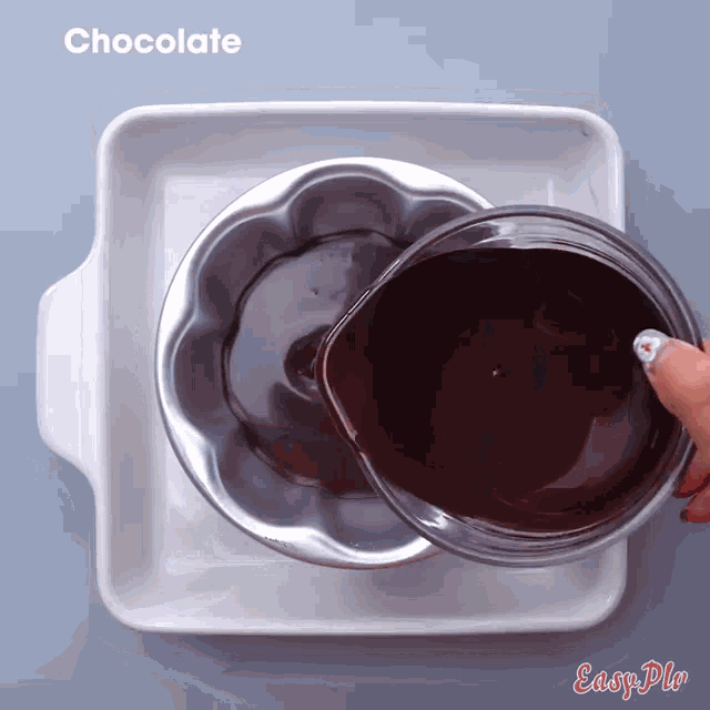 a person is pouring chocolate into a pan with the word chocolate above it
