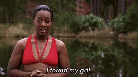 a woman in a red bikini is saying `` i found my grit '' .