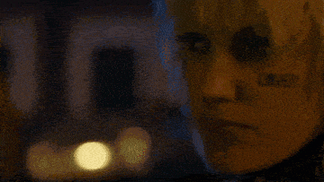 a close up of a woman 's face with lower written on her face