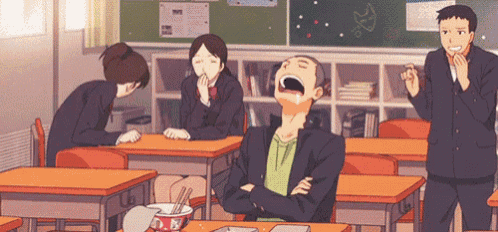 a group of people are sitting at their desks in a classroom with a man yawning .