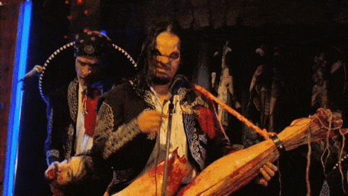 a man in a sombrero is playing a guitar