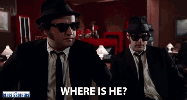 a poster for the blues brothers shows two men in suits