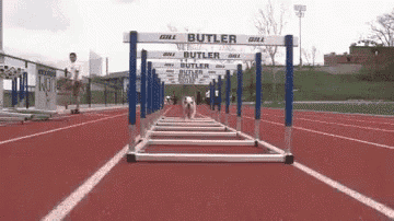 a row of hurdles on a track that say butler