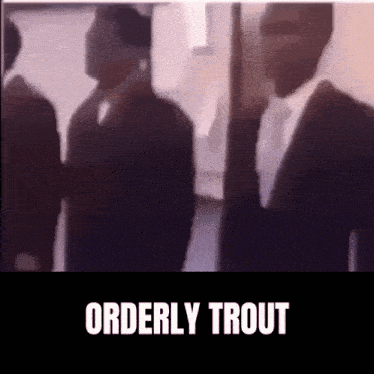 a blurred image of a man in a suit and tie with the words orderly trout above him