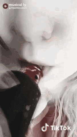 a close up of a person 's mouth with a tiktok logo on it
