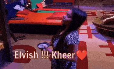 a woman in a leopard print dress is holding a bowl with the words elvish kheer above her
