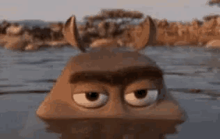 a cartoon character with horns is swimming in a body of water .