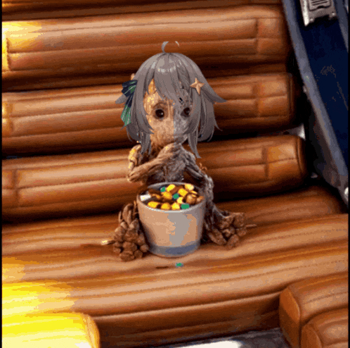 a girl with a star on her head is sitting on a couch eating popcorn