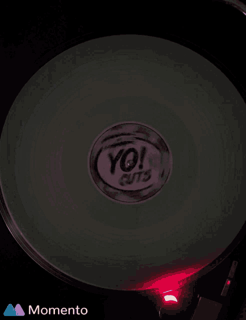 a record with the word yo on it is glowing in the dark