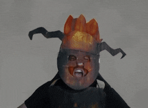 a person wearing a mask that looks like a fireball