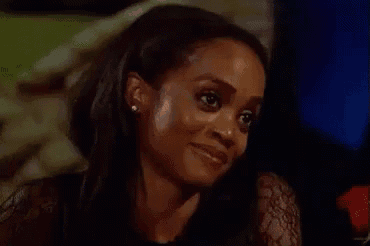 a close up of a woman 's face with a slight smile on her face .