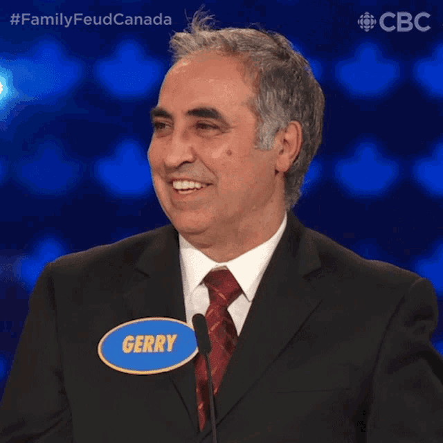 a man in a suit and tie has a name tag that reads gerry