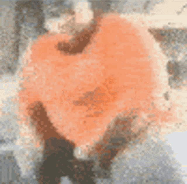 a blurry picture of a person standing in front of a car that is on fire