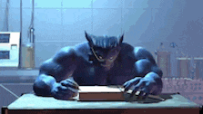 a werewolf is writing on a piece of paper while sitting at a table .