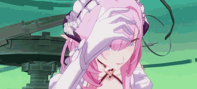 a girl with pink hair is covering her face with her hand
