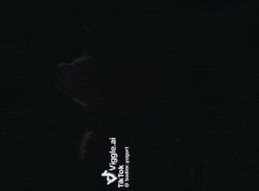 a man in a blue hoodie is dancing with the words tiktok viggle.ai on the bottom right