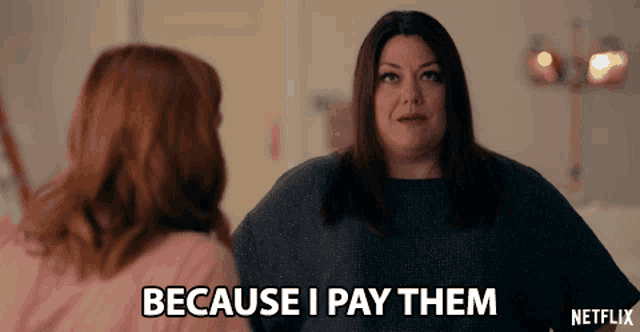 a woman says because i pay them while another woman looks on
