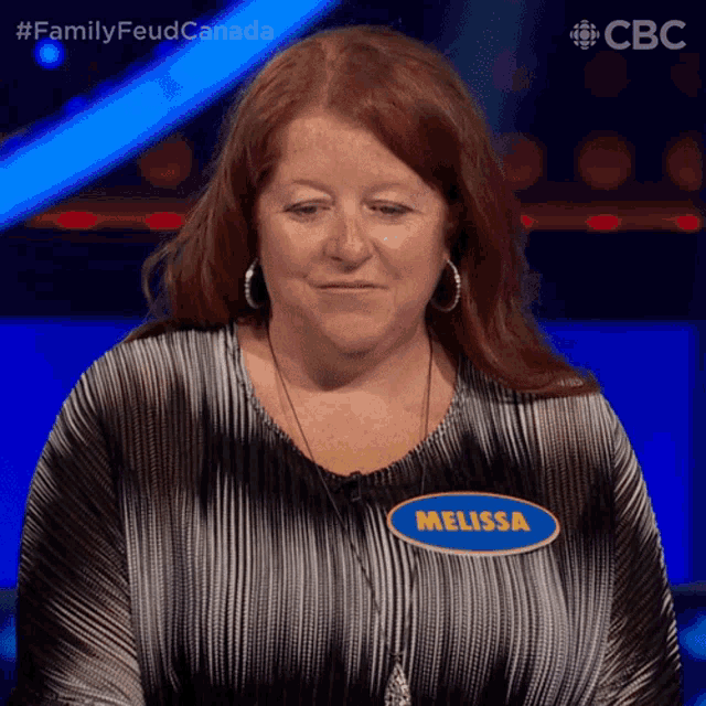 a woman wearing a name tag that says melissa on it