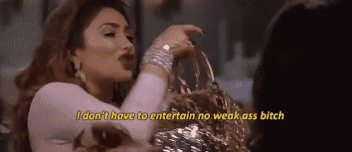 a woman is holding a gold purse and saying `` i don t have to entertain no weak ass bitch '' .
