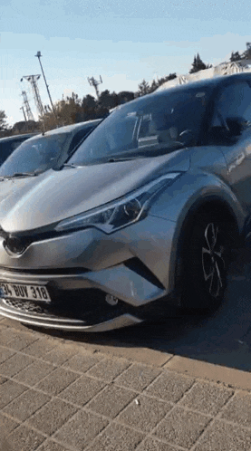 a silver toyota corolla with a license plate that says 34 buy 318