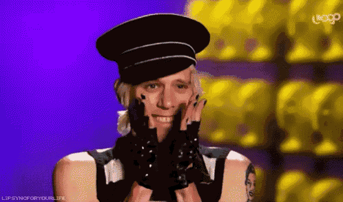 a man wearing a hat and gloves is smiling with a loop logo in the background
