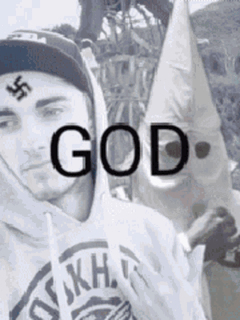 a man with a swastika on his forehead is wearing a hoodie that says ' god '