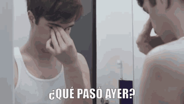 a man in a white tank top looks at himself in a mirror with the words que paso ayer below him