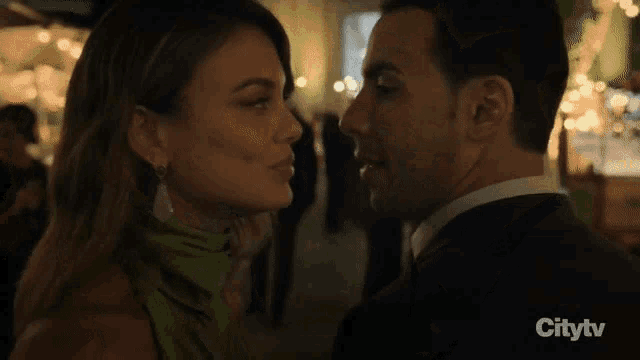 a man and a woman are looking into each other 's eyes on citytv