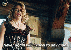 a woman in a corset says never again will i kneel to any man