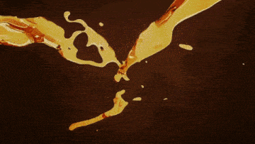 a dark background with a lot of gold sparkles on it