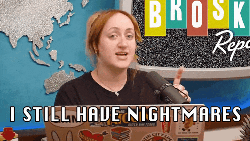 a woman speaking into a microphone with the words " i still have nightmares " written below her