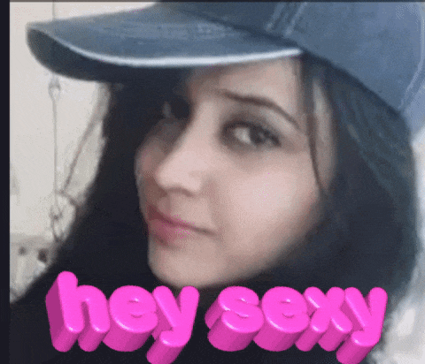 a woman wearing a hat with the words hey sexy written in pink