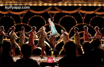 a group of women are dancing on a stage and the website kulfyapp.com is visible in the corner .