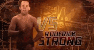 a man is standing in front of a sign that says roderick strong on it
