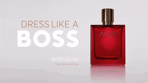 a red bottle of boss alive perfume sits on a table