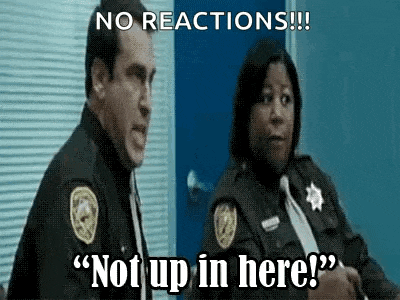 a man and a woman in police uniforms are standing next to each other and the woman is saying " not up in here " .