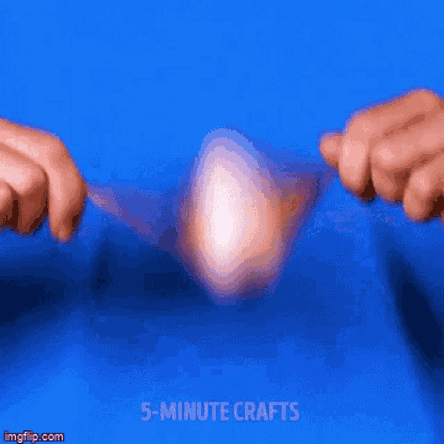 a person is holding a spoon over an egg and the words 5 minute crafts are on the bottom of the screen
