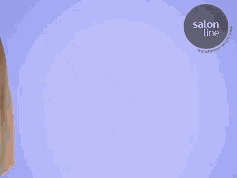 a woman in a black leather jacket is standing in front of a blue background with a salon line logo on it