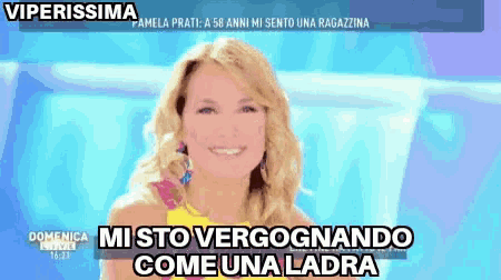 a woman in a yellow top is smiling and says " viperissima "
