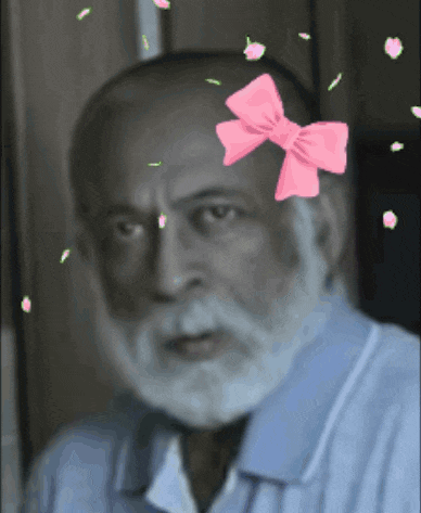 an older man with a pink bow on his head