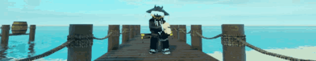 a person standing on a wooden dock with a sword and the letter n on his shirt